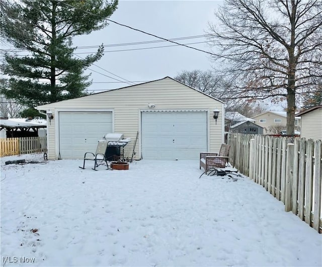 view of snow covered garage