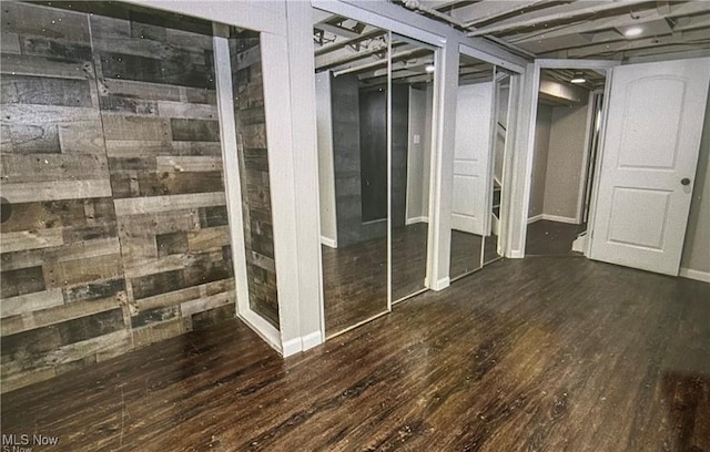 basement featuring dark hardwood / wood-style floors