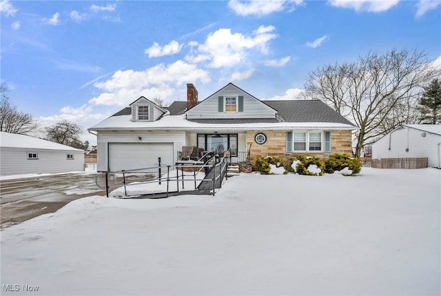 view of front facade featuring a garage and covered porch