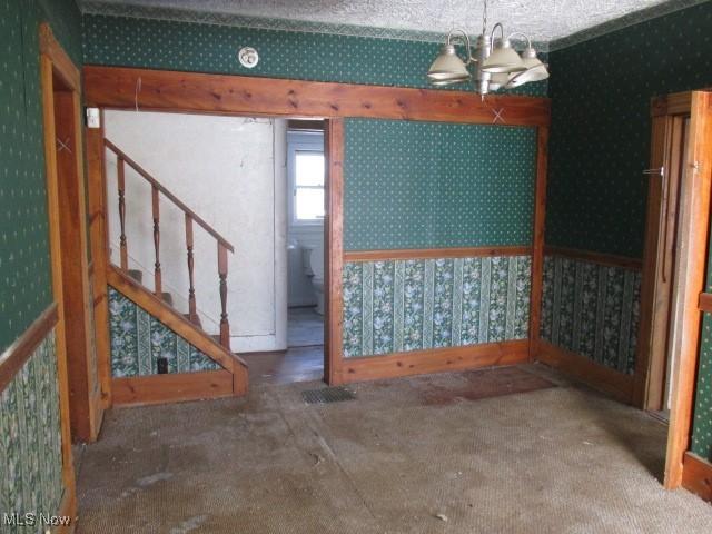 basement featuring a notable chandelier