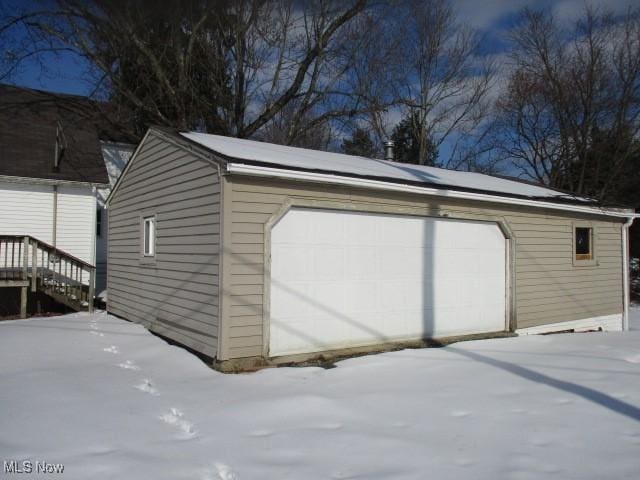 view of snow covered garage