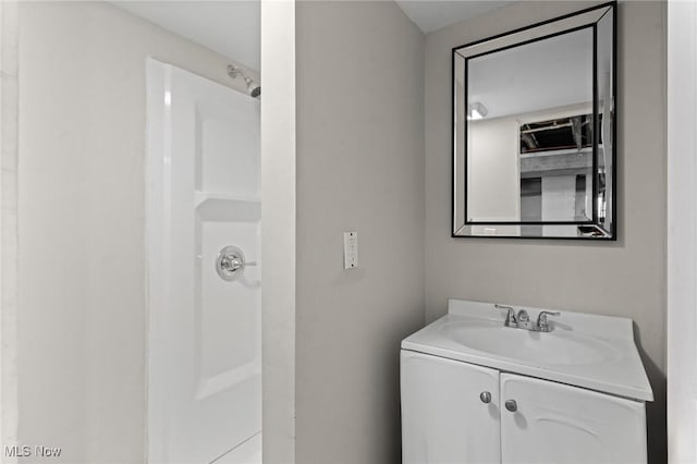 bathroom with vanity and walk in shower