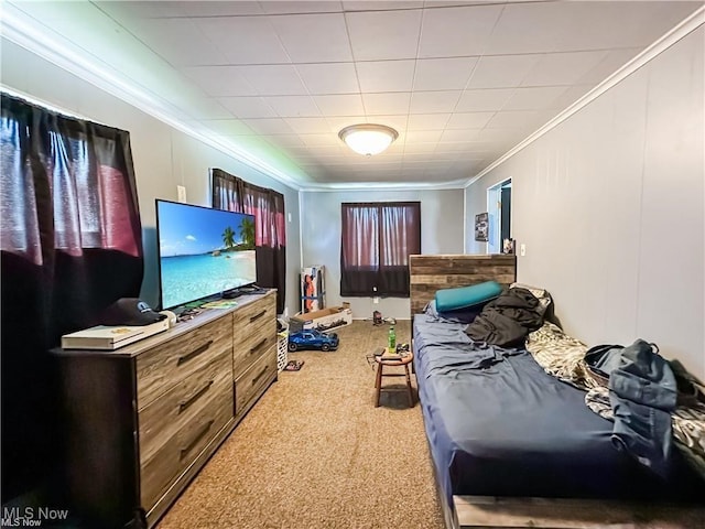 bedroom featuring crown molding and carpet floors