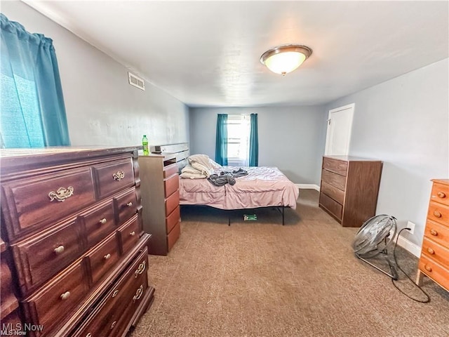 bedroom with light carpet