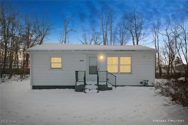 view of snow covered house