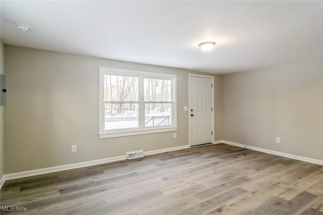 unfurnished room featuring light hardwood / wood-style floors