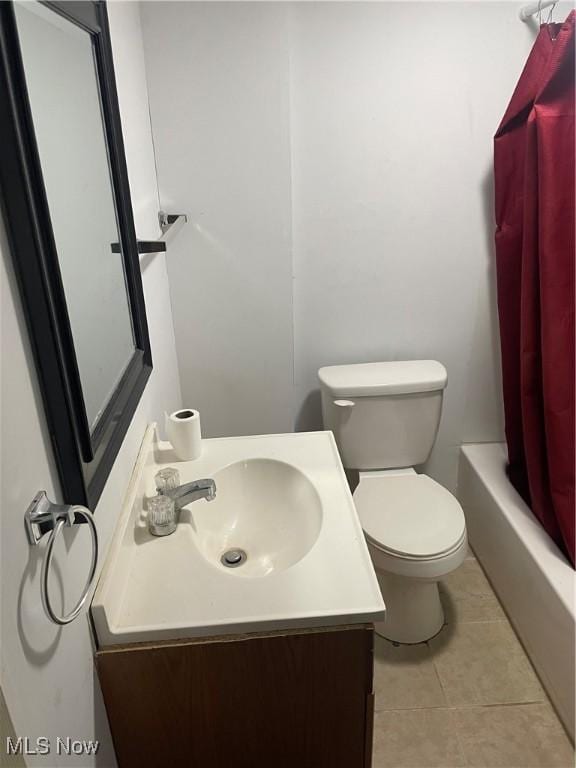 full bathroom featuring tile patterned flooring, vanity, shower / tub combo, and toilet