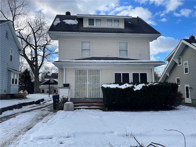 view of snow covered house