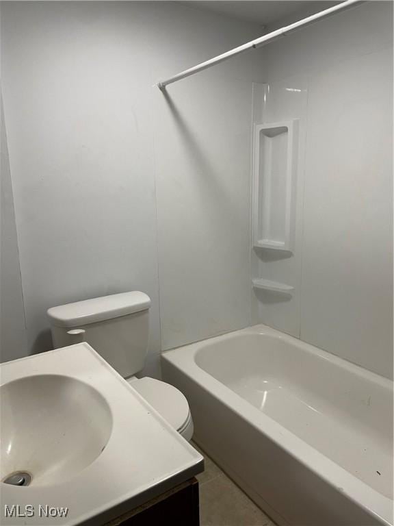 full bathroom featuring sink, tile patterned floors, bathing tub / shower combination, and toilet