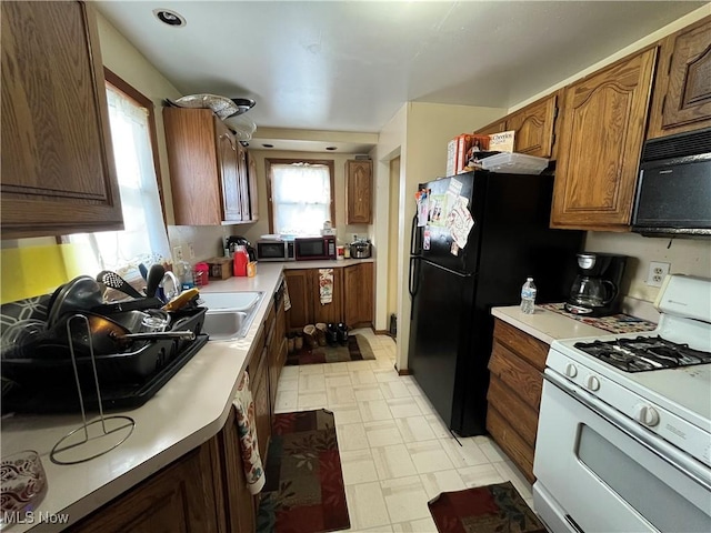 kitchen featuring sink and black appliances