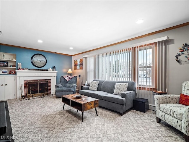 carpeted living room featuring crown molding, a baseboard radiator, and a fireplace