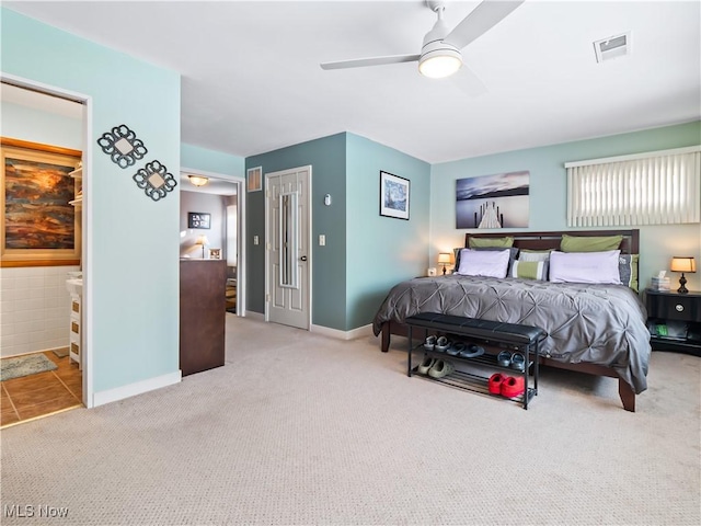 bedroom featuring connected bathroom, ceiling fan, and carpet