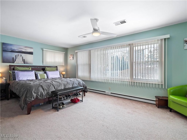 bedroom with carpet floors, a baseboard radiator, and ceiling fan