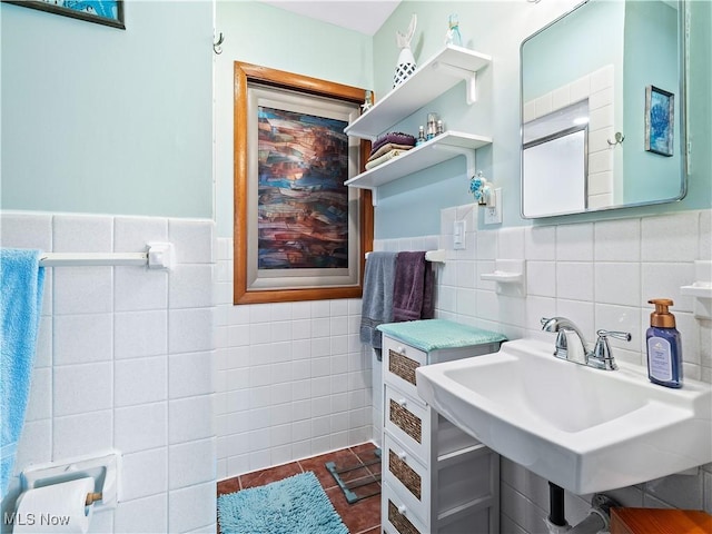 bathroom featuring tile walls, sink, and tile patterned floors