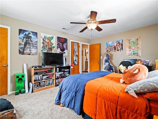 carpeted bedroom with ceiling fan