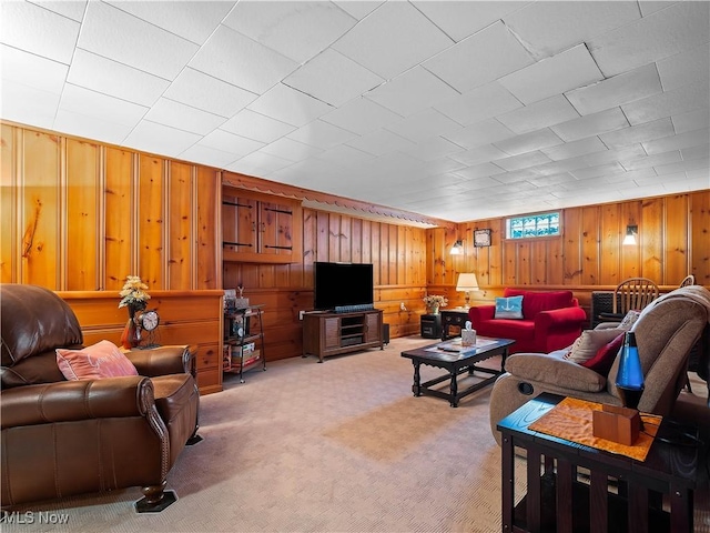 living room featuring light colored carpet and wood walls