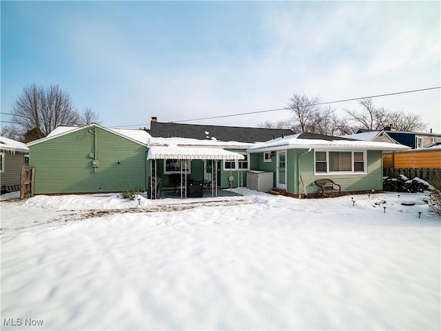 view of snow covered house