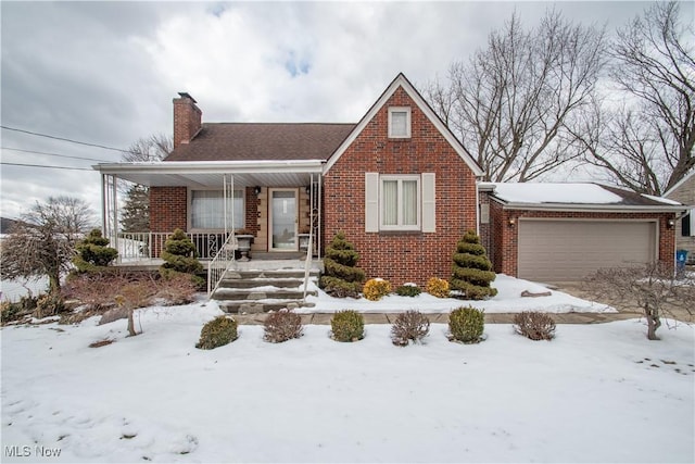 view of front of house featuring a porch and a garage