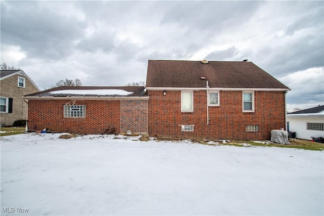 view of snow covered house