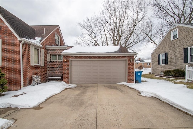 view of snow covered garage