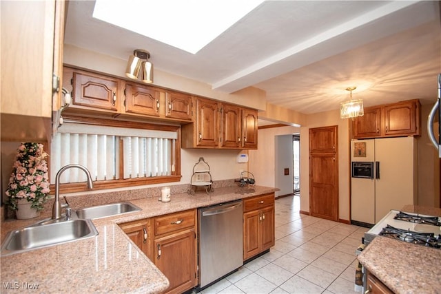 kitchen featuring light tile patterned floors, sink, dishwasher, white fridge with ice dispenser, and decorative light fixtures