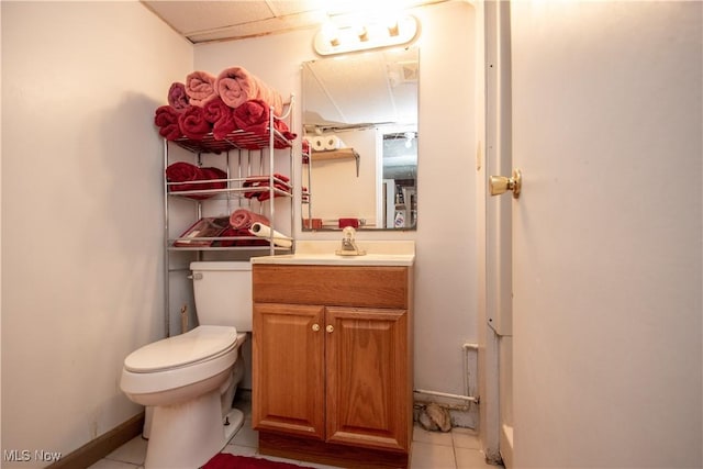 bathroom with vanity, tile patterned floors, and toilet