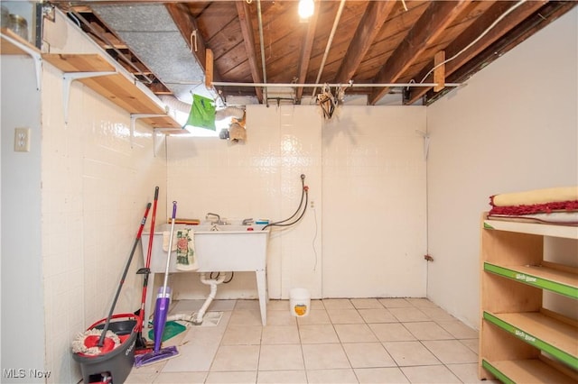 basement featuring tile patterned flooring