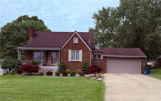 576 Breetz Dr, Campbell, OH 44405 - view of front of home with brick siding, concrete driveway, a garage, and a front yard