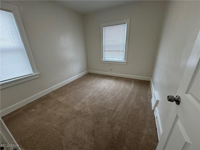 unfurnished room featuring carpet flooring