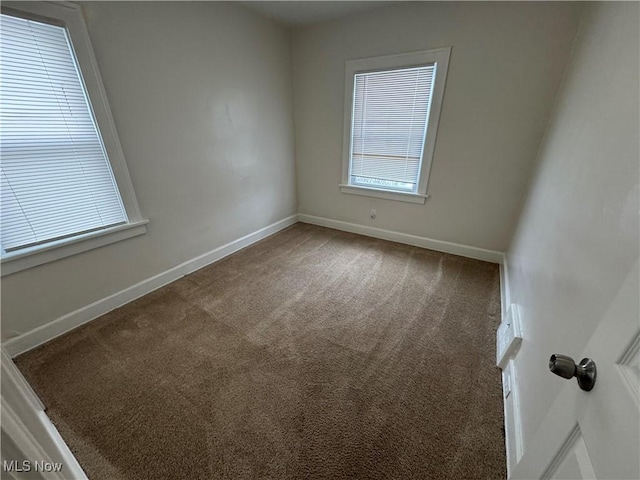 unfurnished room with carpet flooring