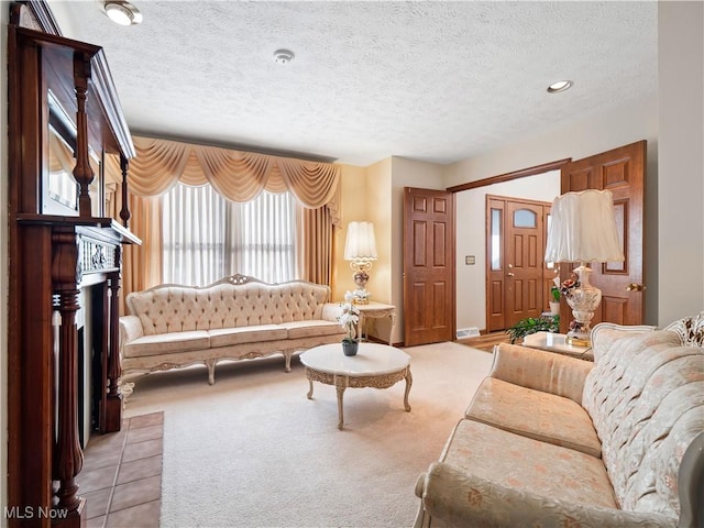 living room with light colored carpet and a textured ceiling