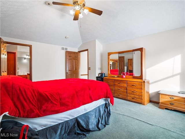 bedroom featuring ceiling fan, light colored carpet, and vaulted ceiling