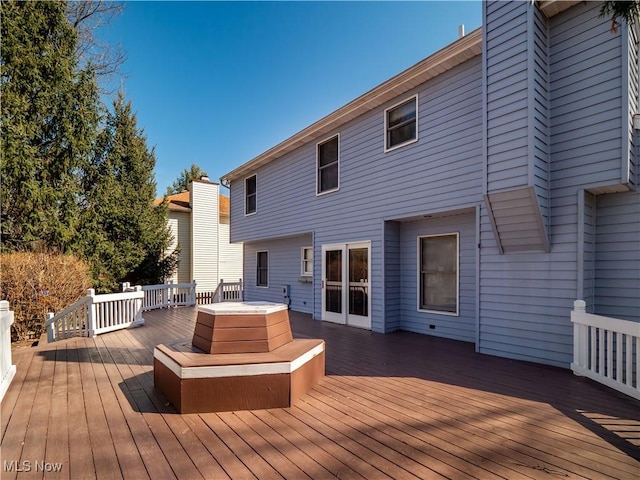 wooden deck with a jacuzzi