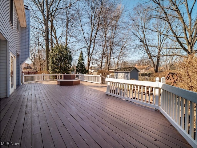 wooden deck with an outdoor structure