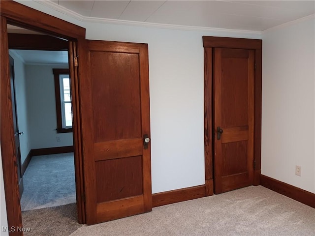 unfurnished bedroom with light carpet and ornamental molding