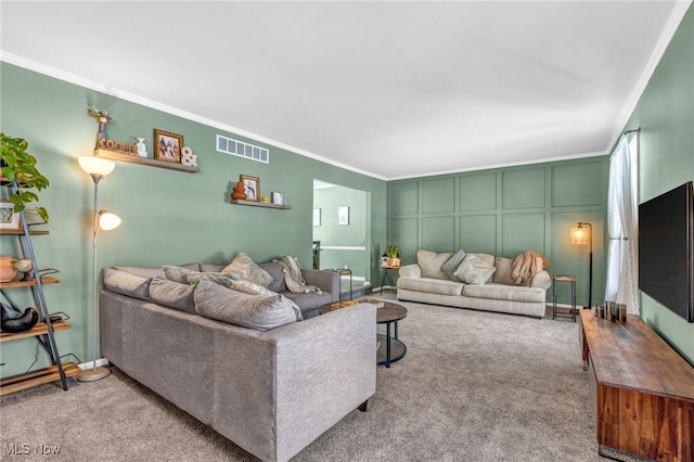 carpeted living room featuring crown molding