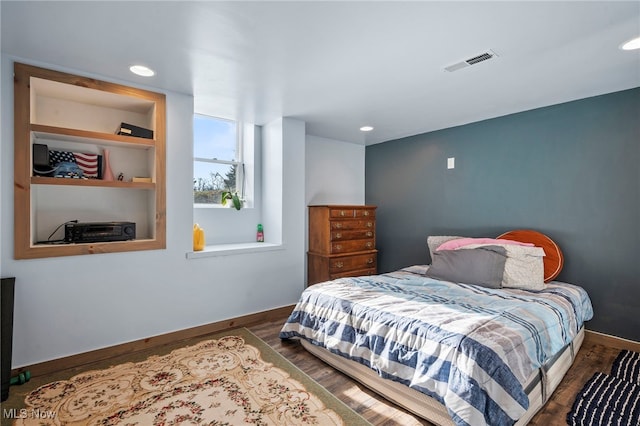 bedroom with recessed lighting, visible vents, baseboards, and dark wood-type flooring