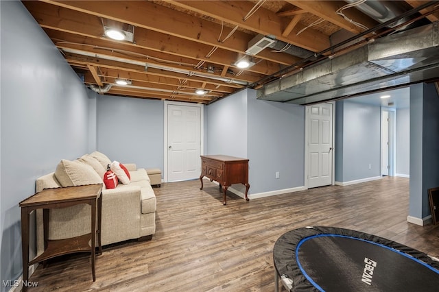 sitting room with wood finished floors and baseboards