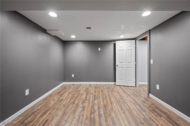 unfurnished room featuring recessed lighting, visible vents, baseboards, and wood finished floors