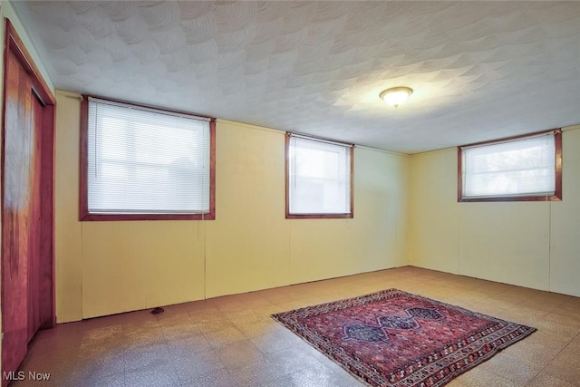 empty room featuring a textured ceiling