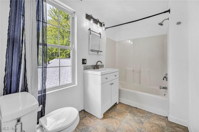 full bathroom with vanity, toilet, and washtub / shower combination