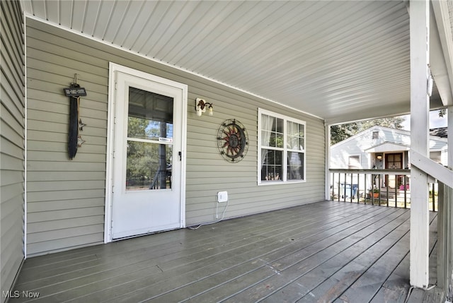 wooden terrace featuring a porch