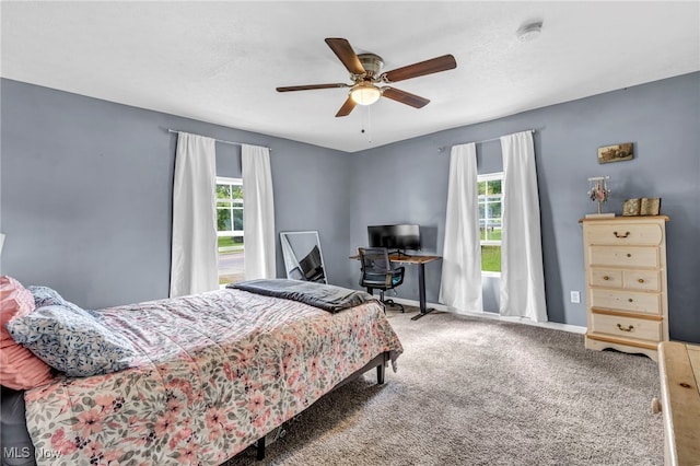 bedroom with ceiling fan and carpet flooring