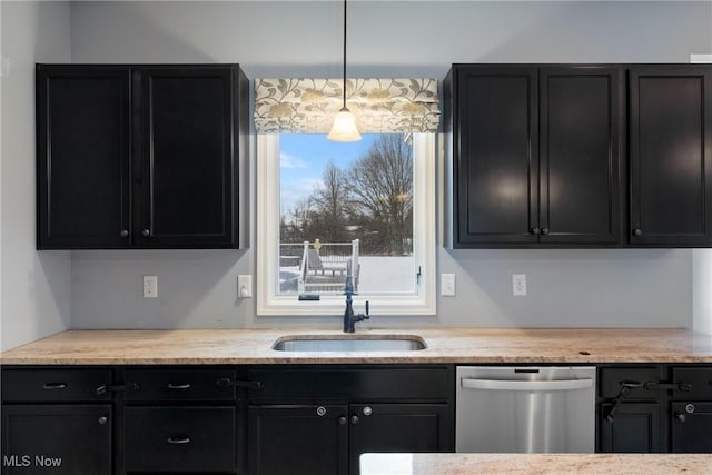 kitchen with pendant lighting, dishwasher, and sink