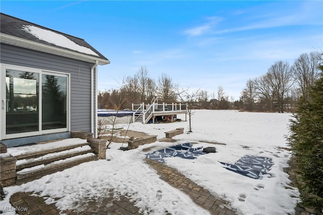 view of yard layered in snow