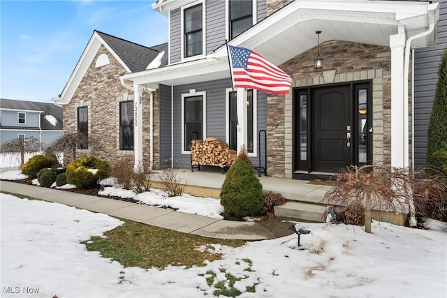 view of snow covered property entrance