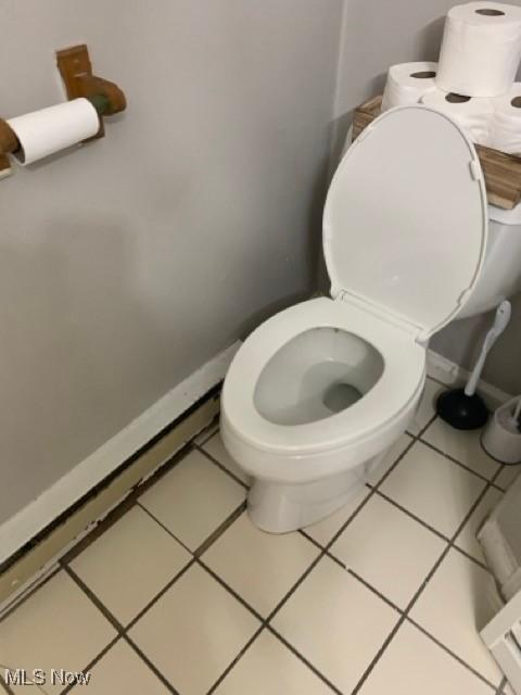 bathroom with tile patterned flooring and toilet