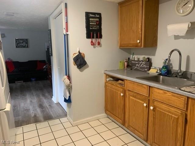 kitchen with sink and light tile patterned floors