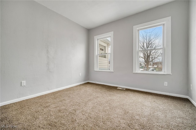 unfurnished room with carpet floors