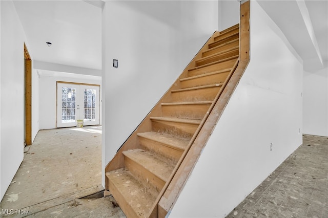 stairway featuring french doors